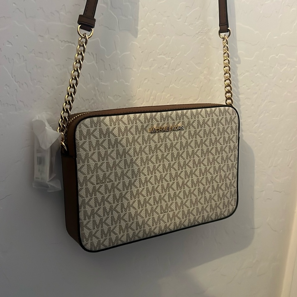 Michael Kors purse with tan strap and gold chain details. NWT never used.